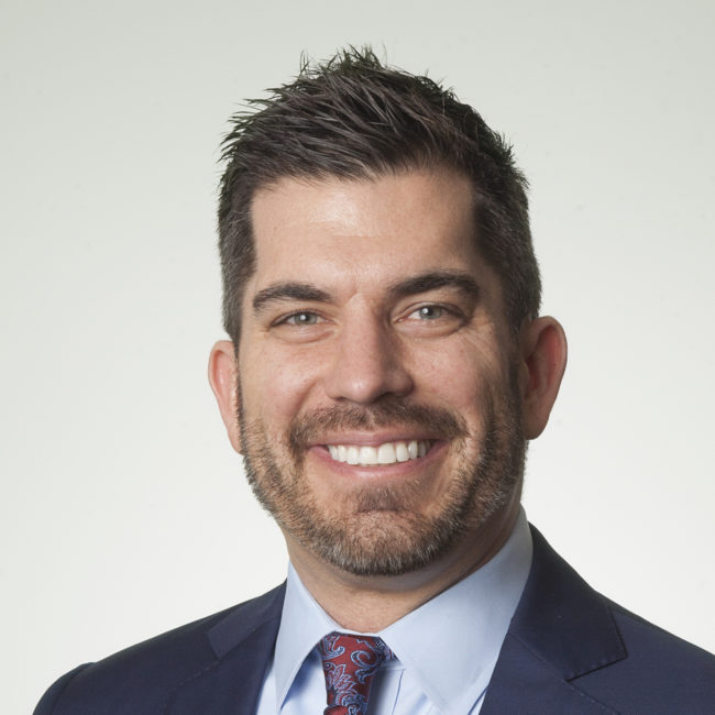 Smiling man business headshot in suit Smiling man business headshot in suit