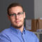 Portrait of young man with glasses, blue shirt Portrait of young man with glasses, blue shirt