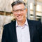 Smiling businessman in suit and glasses outdoors Smiling businessman in suit and glasses outdoors